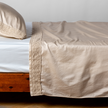Bella Notte Bria flat sheet in Cenote with Novola lace, showcasing soft linen fabric and elegant lace detailing.