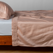 Bella Notte Bria flat sheet in Cenote with Novola lace detailing, showcasing soft, luxurious bedding fabric and intricate lace accents.