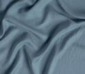 Bella Notte Madera Luxe flat sheet with cuff edge, king size, soft fabric, and elegant design, shown in a cozy bedroom setting.
