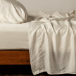 Bella Notte Madera Luxe flat sheet with cuff edge in natural fabric, showcasing soft, luxurious bedding material.