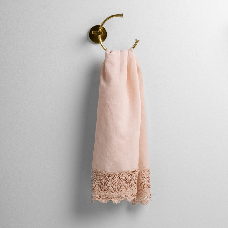White Bella Notte Mattine Guest Towel with soft, textured fabric, displayed folded on a bathroom countertop.