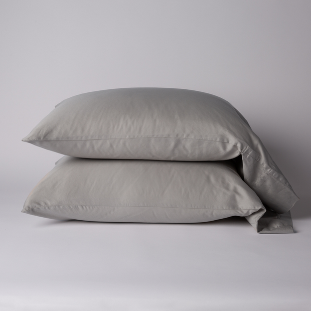 Bella Notte Bria pillowcase in Cenote fabric, showcasing soft, luxurious cotton with elegant stitching detail.