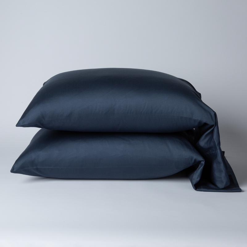 Bella Notte Bria pillowcase in Cenote fabric, showcasing soft, luxurious fabric with detailed stitching on a king-sized pillow.