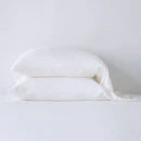 Bella Notte Madera Luxe pillowcase with cuff edge, soft fabric, in a cloud color, showcasing elegant, cozy bedding detail.