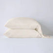 Bella Notte Madera Luxe pillowcase with cuff edge, soft fabric in cloudy color, showcasing elegant design and smooth texture.
