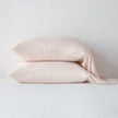Bella Notte Madera Luxe pillowcase with cuff edge, soft fabric, in a cloud color, showcasing elegant bedroom decor.