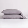 Bella Notte Madera Luxe pillowcase with cuff edge, soft fabric, and cloud pattern for luxurious bedroom decor.