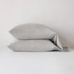 Bella Notte Madera Luxe pillowcase with cuff edge in soft cloud color, showcasing elegant fabric and detailed cuff design.