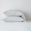 Bella Notte Madera Luxe pillowcase with cuff edge, soft fabric, and cloud color, showcasing elegant bedding detail.