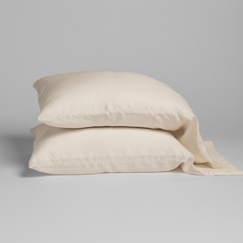 Natural-colored Bella Notte Madera Luxe pillowcase with cuff edge, showcasing soft, luxurious fabric and elegant design.
