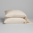 Natural-colored Bella Notte Madera Luxe pillowcase with cuff edge, showcasing soft, luxurious fabric and elegant design.