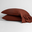 White Bella Notte Linen Whisper pillowcase on a standard bed, showcasing soft, textured linen fabric and elegant stitching.