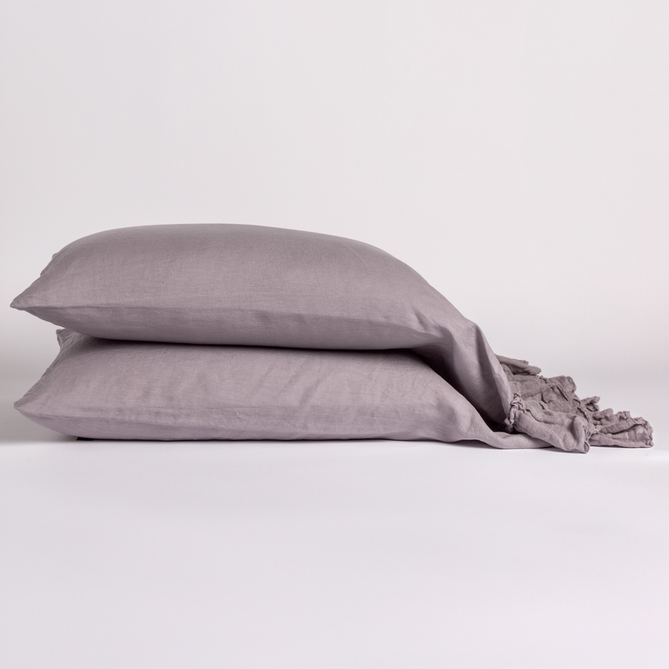 White Bella Notte Linen Whisper pillowcase on a standard pillow, showcasing soft, smooth fabric and elegant design.