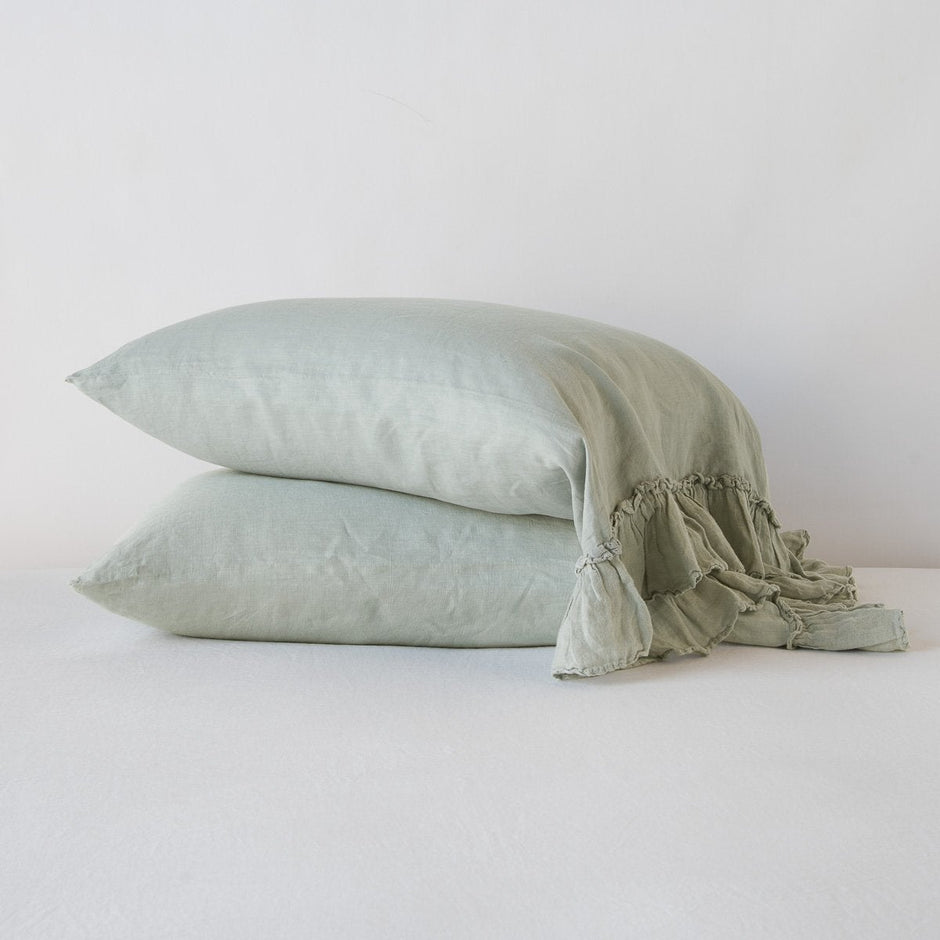 White Bella Notte Linen Whisper Pillowcase on a standard pillow, showcasing soft, elegant linen fabric and subtle texture.