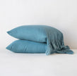 White Bella Notte Linen Whisper pillowcase shown on a bed, featuring soft fabric and elegant stitching for a luxurious look.