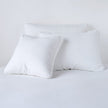 Bella Notte Austin Sham in Cenote fabric, showcasing soft, luxurious textile with elegant stitching for a refined bedroom look.
