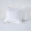 Bella Notte French Lavender linen sham showcasing soft, textured fabric with elegant piping detail for a luxurious bedroom accent.