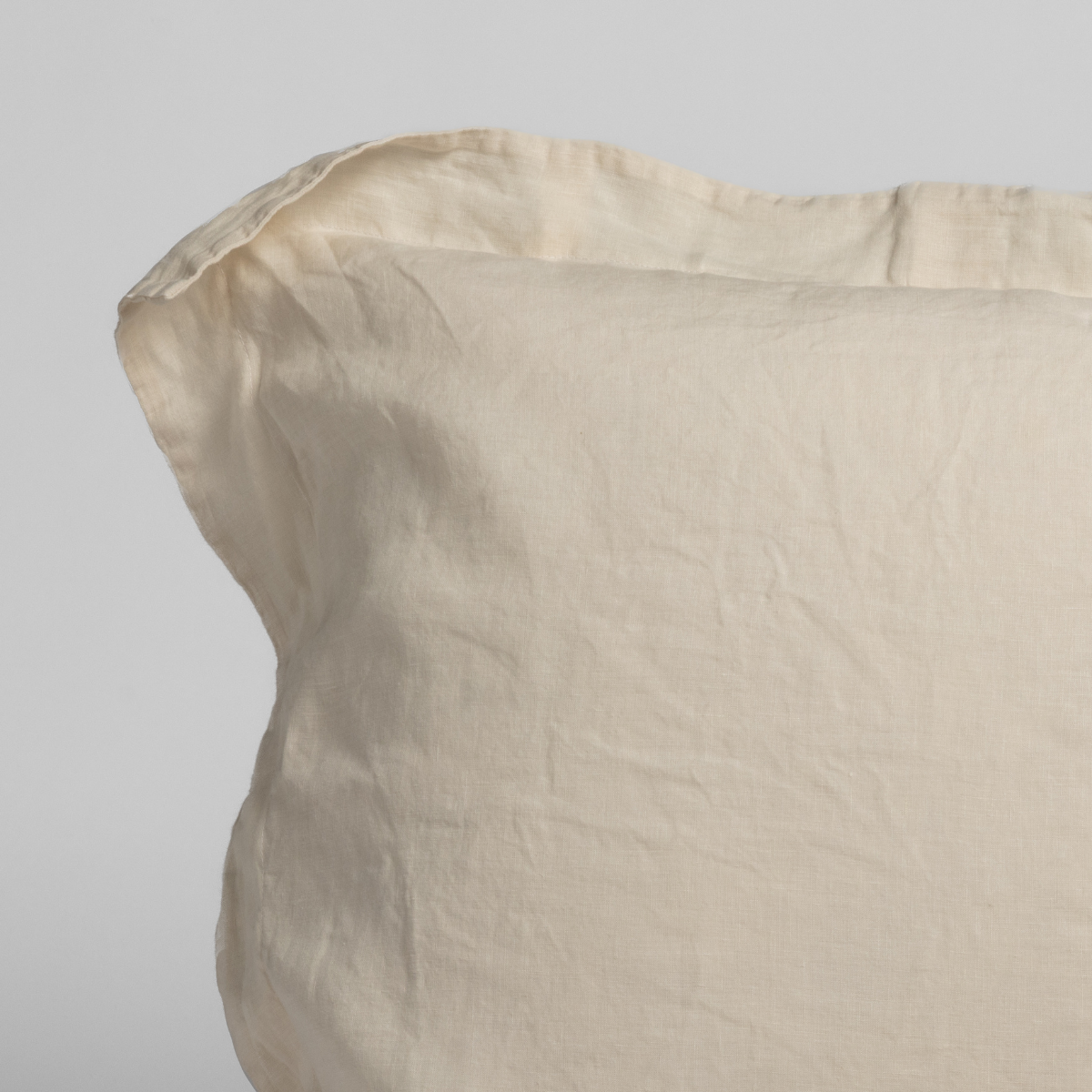 Natural linen sham by Bella Notte featuring a corner detail, soft textured linen fabric perfect for elegant bedroom decor.