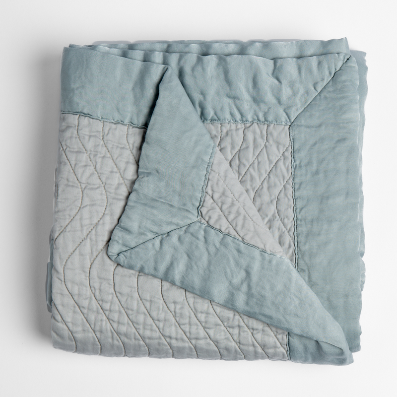 Bella Notte Cirillo throw blanket with autumn-colored fabric, showcasing soft texture and cozy design for home decor.