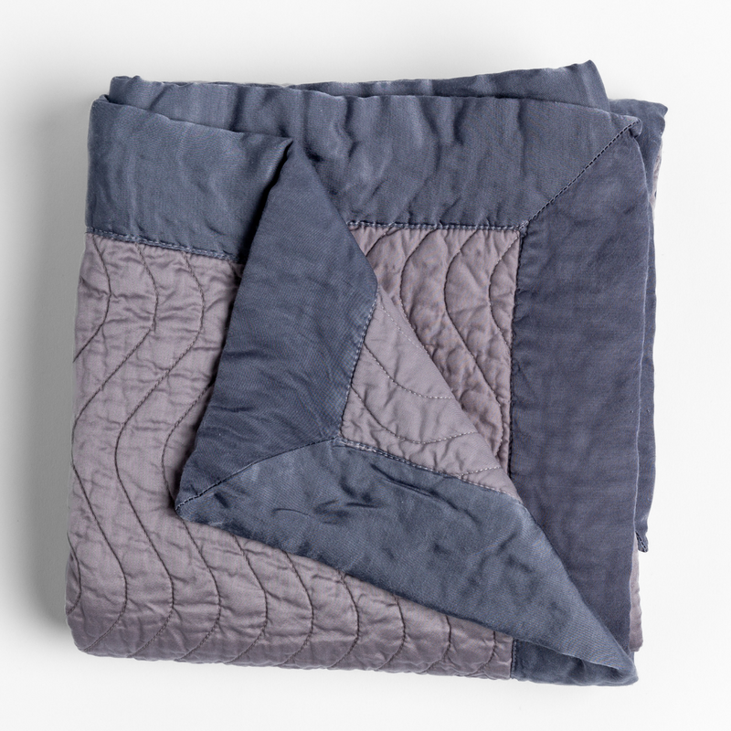 Bella Notte Cirillo Throw Blanket in rich autumn colors with soft, cozy fabric detail.