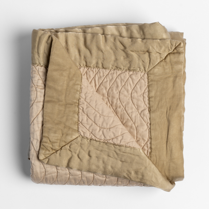 Bella Notte Cirillo Throw Blanket in warm autumn tones, soft fabric with a cozy, textured design for comfortable lounging.