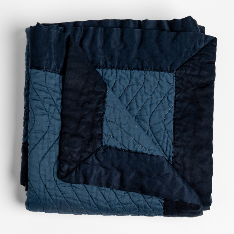 Bella Notte Cirillo Throw Blanket in warm autumn tones, soft and cozy for elegant home decor.