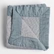 Bella Notte Cirillo throw blanket with autumn-colored fabric, showcasing soft, cozy texture and elegant design.