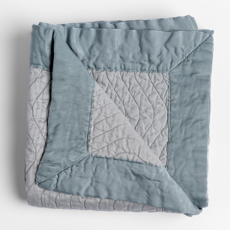 Bella Notte Cirillo throw blanket with autumn-colored fabric, showcasing soft, cozy texture and elegant design.