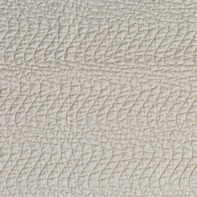 Bella Notte Cirillo throw blanket shown in warm autumn tones, showcasing soft fabric and cozy texture for home comfort.