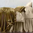 Bella Notte Loulah throw blanket featuring soft, plush fabric in warm autumn tones, perfect for cozying up on the sofa.