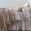 Bella Notte Loulah throw blanket with soft, cozy fabric in warm autumn tones, perfect for adding comfort to your living space.
