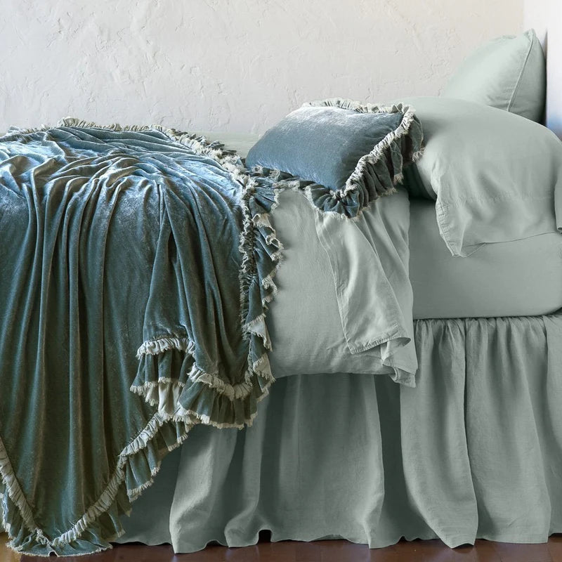 Bella Notte Loulah throw blanket in autumn color, soft fabric, draped over a cozy armchair for elegant home decor.