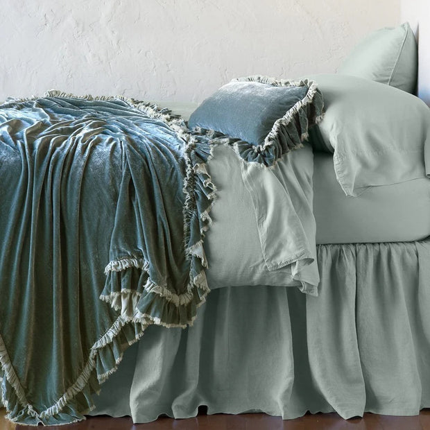 Bella Notte Loulah throw blanket in autumn color, soft fabric, draped over a cozy armchair for elegant home decor.