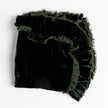 Bella Notte Loulah throw blanket in warm autumn colors, soft and cozy fabric, displayed on a neatly made bed.
