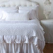 Bella Notte silk velvet quilted throw blanket with luxurious, soft fabric and elegant stitching in warm autumn tones.