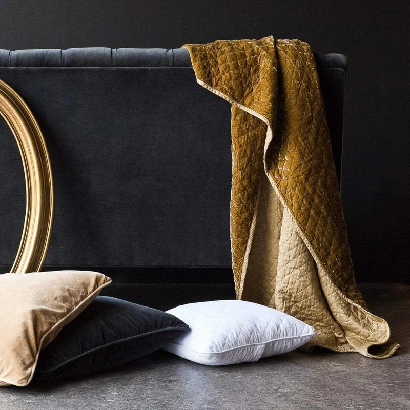 Bella Notte silk velvet quilted throw blanket featuring a luxurious, soft autumn-colored fabric with a stylish quilted pattern.