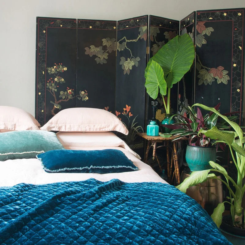 Bella Notte silk velvet quilted throw blanket with a luxurious, soft texture in rich autumn tones.