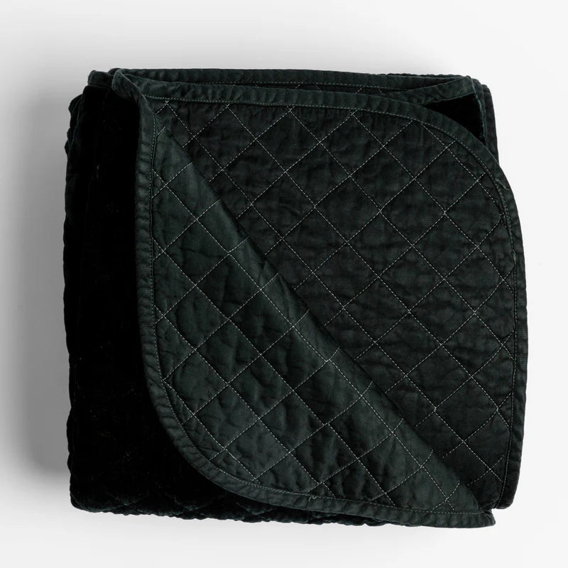 Silk velvet quilted throw blanket by Bella Notte in rich autumn colors, showcasing soft, textured fabric and elegant quilting details.