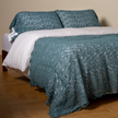 Bella Notte Allora Bed Scarf throw blanket with elegant Cenote design, soft fabric, draped over a bed for a cozy, stylish look.