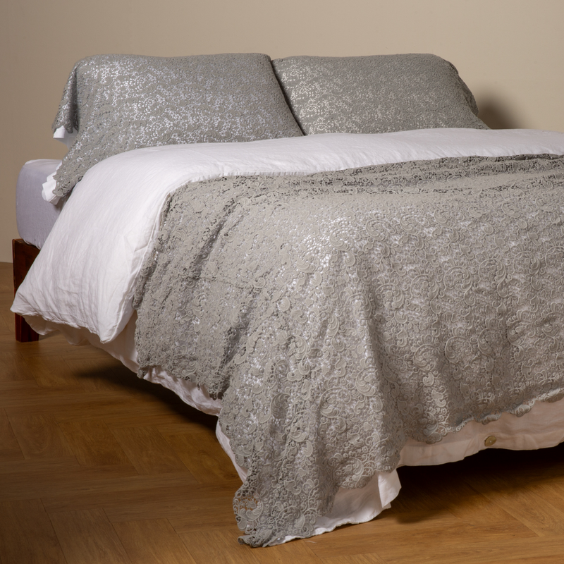 Bella Notte Allora Bed Scarf throw blanket with intricate Cenote pattern, draped over a bed for a cozy, elegant look.