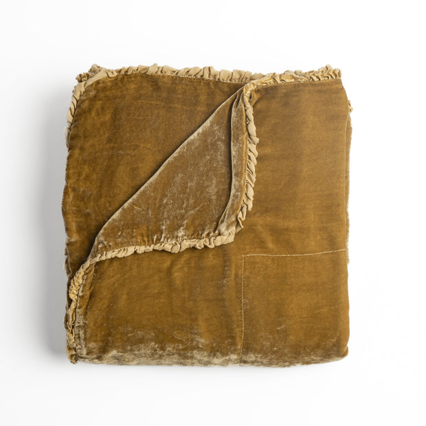 Bella Notte Carmen throw blanket with honeycomb pattern, soft and cozy fabric, displayed in warm honey color.