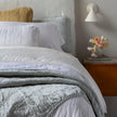 Bella Notte Tahoe Blue Sel Throw Blanket spread on a cozy sofa, showcasing soft, luxurious fabric and elegant design.
