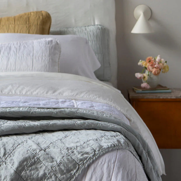 Bella Notte Tahoe Blue Sel Throw Blanket spread on a cozy sofa, showcasing soft, luxurious fabric and elegant design.