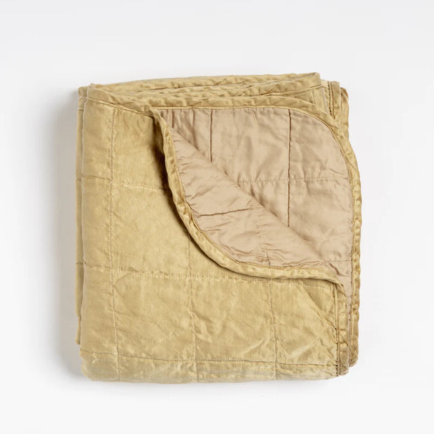 Bella Notte Tahoe Blue Sel throw blanket spread neatly on a bed, showcasing soft, cozy fabric and elegant design.