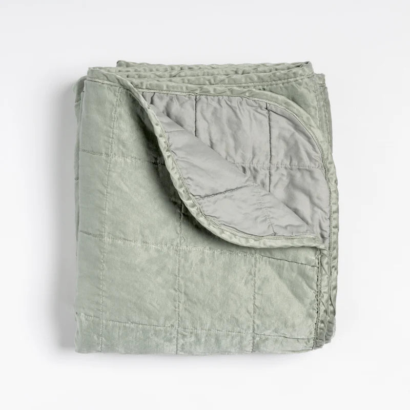 Bella Notte Tahoe Blue Sel Throw Blanket spread on a cozy sofa, showcasing soft, luxurious fabric and elegant design.