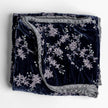 Bella Notte Lynette throw blanket in Tahoe Blue, soft and cozy fabric, draped on a sofa for a stylish home decor touch.