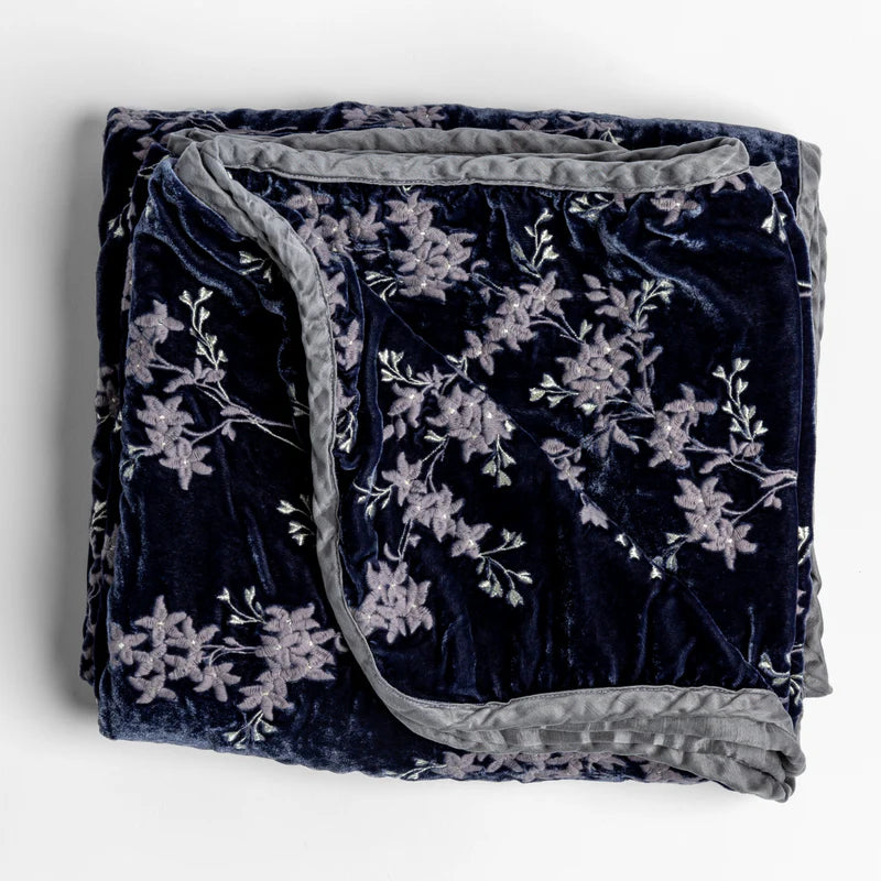 Bella Notte Lynette throw blanket in Tahoe Blue, soft and cozy fabric, draped on a sofa for a stylish home decor touch.