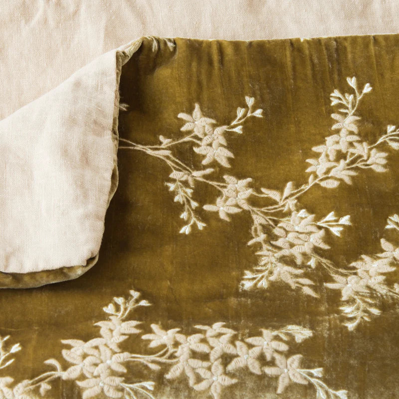Bella Notte Lynette Throw Blanket in Tahoe Blue, soft and cozy fabric, draped over a sofa for a stylish, comfortable look.