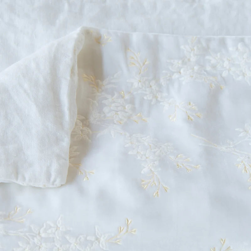 Bella Notte Lynette throw blanket in Tahoe Blue, soft and cozy fabric, displayed folded with textured details.