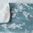 Bella Notte Lynette throw blanket in Tahoe Blue, showcasing soft fabric and cozy texture for comfortable home decor.